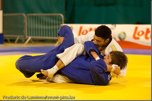 Visé - January 30 : Ashley MC KENZIE from GBR (white) compete with  Mikos SALMINEN from NLD (blue) in the final round match for the 3rd place of Men's -60 Kg during the Judo Open International 2010 in Visé, Belgium. MC KENZIE won  the match.