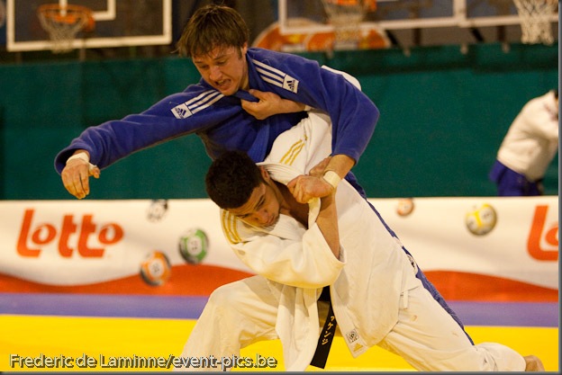Visé - January 30 : Ashley MC KENZIE from GBR (white) compete with  Mikos SALMINEN from NLD (blue) in the final round match for the 3rd place of Men's -60 Kg during the Judo Open International 2010 in Visé, Belgium. MC KENZIE won  the match.
