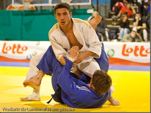 Visé - January 30 : Ashley MC KENZIE from GBR (white) compete with  Mikos SALMINEN from NLD (blue) in the final round match for the 3rd place of Men's -60 Kg during the Judo Open International 2010 in Visé, Belgium. MC KENZIE won  the match.