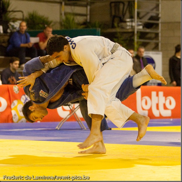 Visé - January 30 : Madda Loni MARCO (blue) from Italy compete with  Guillaume CHAINE from France in the final match of Men's -73 Kg during the Judo Open International 2010 in Visé, Belgium. MARCO won the match.