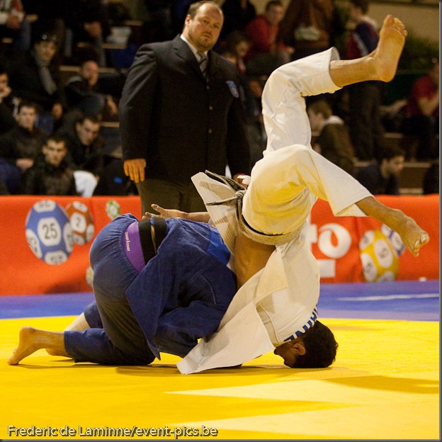 Visé - January 30 : Madda Loni MARCO (blue) from Italy compete with  Guillaume CHAINE from France in the final match of Men's -73 Kg during the Judo Open International 2010 in Visé, Belgium. MARCO won the match.