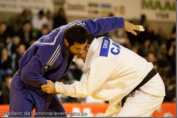 Visé - January 30 : Lyes BOUYAKOUB (blue) from Algeria compete with  Alexandre EDMOND from Canada in the final match of Men's -90 Kg during the Judo Open International 2010 in Visé, Belgium. EDMOND won the match