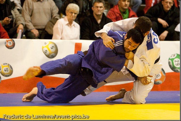 Visé - January 30 : Lyes BOUYAKOUB (blue) from Algeria compete with  Alexandre EDMOND from Canada in the final match of Men's -90 Kg during the Judo Open International 2010 in Visé, Belgium. EDMOND won the match