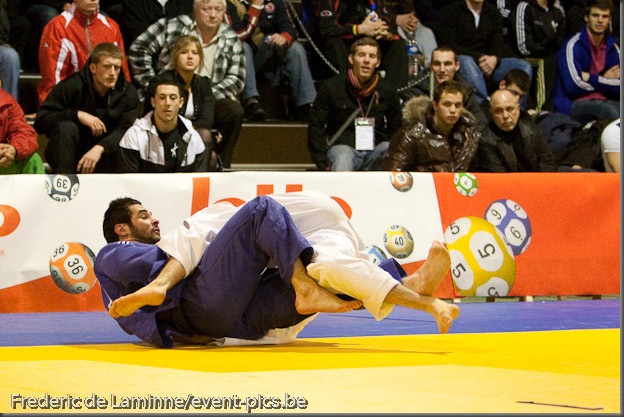 Visé - January 30 : Lyes BOUYAKOUB (blue) from Algeria compete with  Alexandre EDMOND from Canada in the final match of Men's -90 Kg during the Judo Open International 2010 in Visé, Belgium. EDMOND won the match