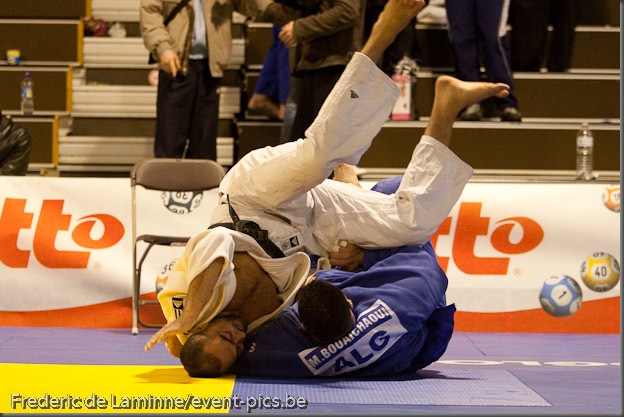 Visé - January 30 : Mohamed BOUAICHAOUI (blue) from Algeria compete with  Jallal BENALLA from France in the final match of Men's +100 Kg during the Judo Open International 2010 in Visé, Belgium. BOUAICHAOUI won the match.