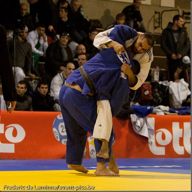 Visé - January 30 : Mohamed BOUAICHAOUI (blue) from Algeria compete with  Jallal BENALLA from France in the final match of Men's +100 Kg during the Judo Open International 2010 in Visé, Belgium. BOUAICHAOUI won the match.